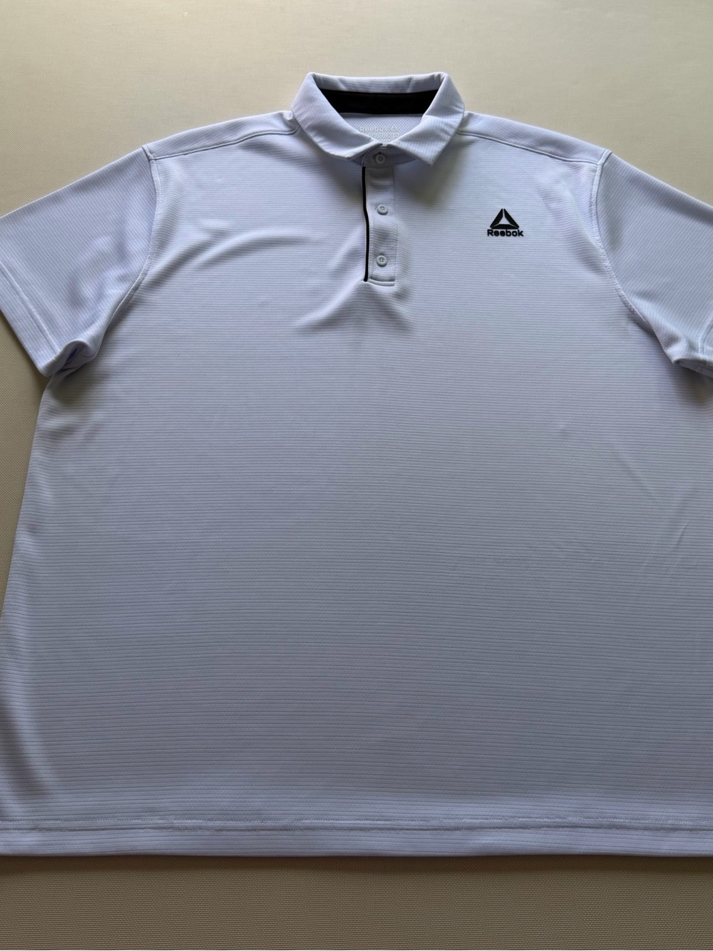Reebok Men's White Polo with Black Logo Accent